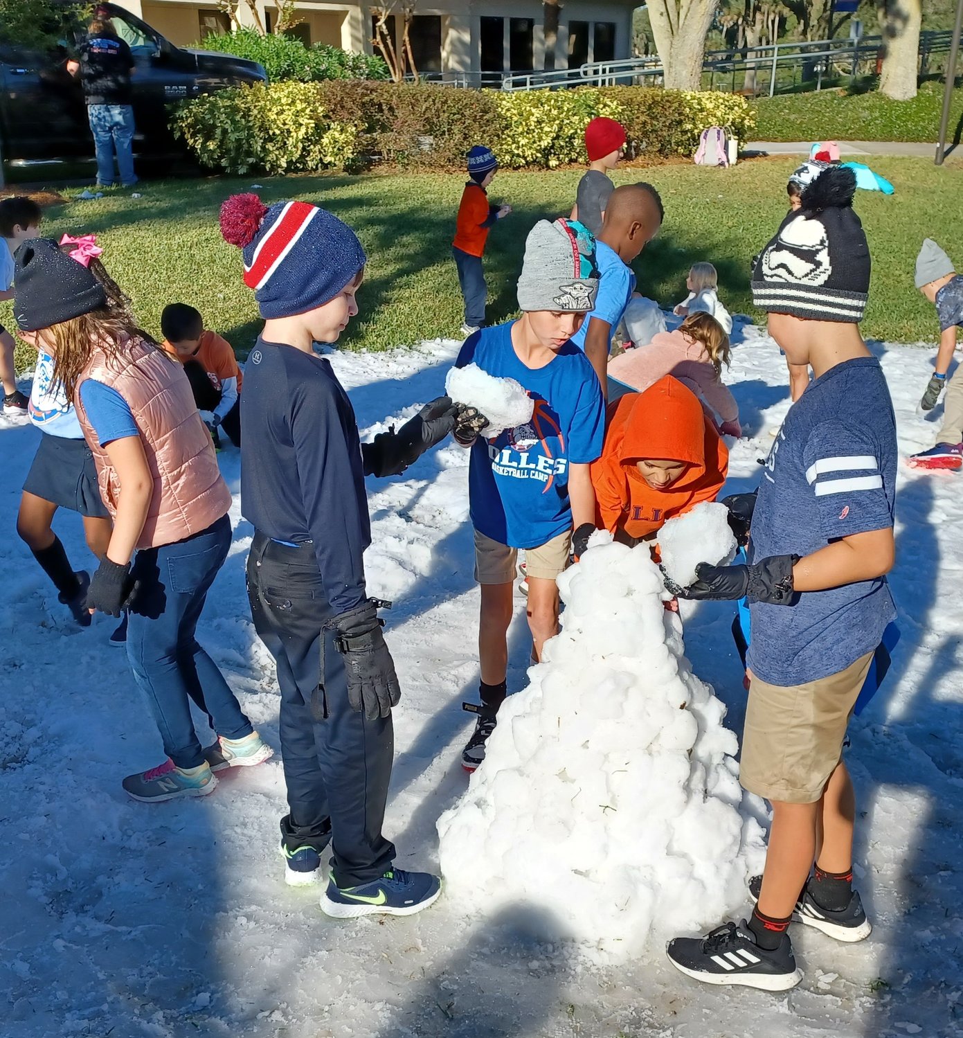 Bolles Lower School Ponte Vedra Beach students build a snowman during Winter Fest.
